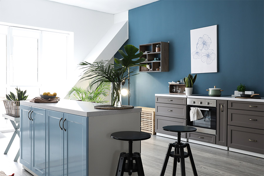 cabinets-in-kitchen-with-blue-accent-wall-kuna-id