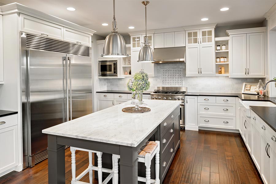 kitchen-with-white-cabinets-and-silver-metal-appliances-kuna-id